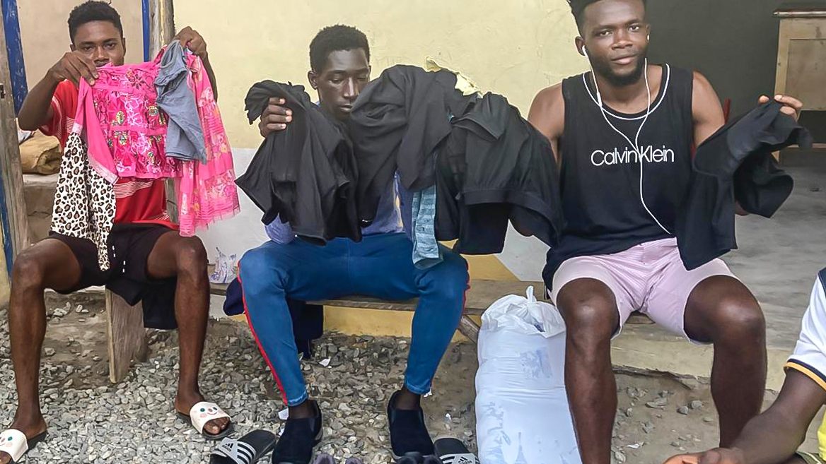 Donated clothing and footwear being handed out in Ghana